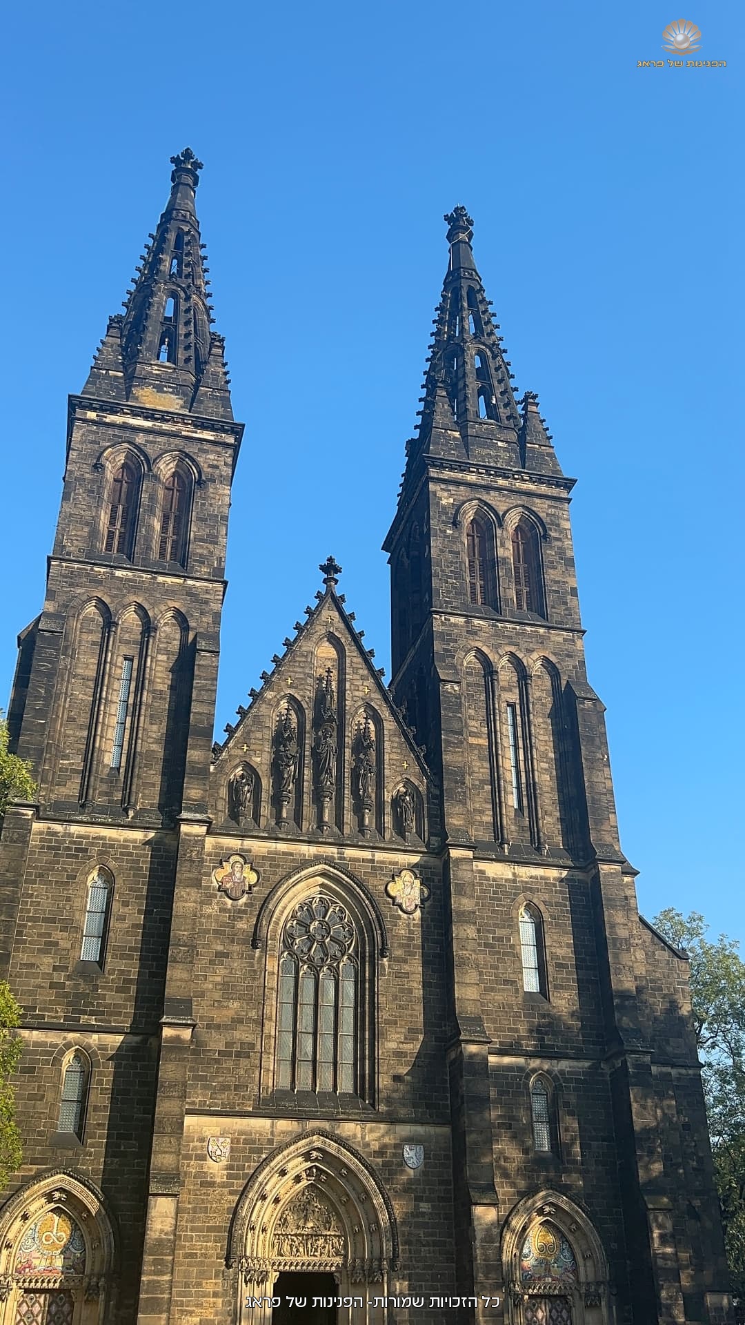 Church towers against blue skies